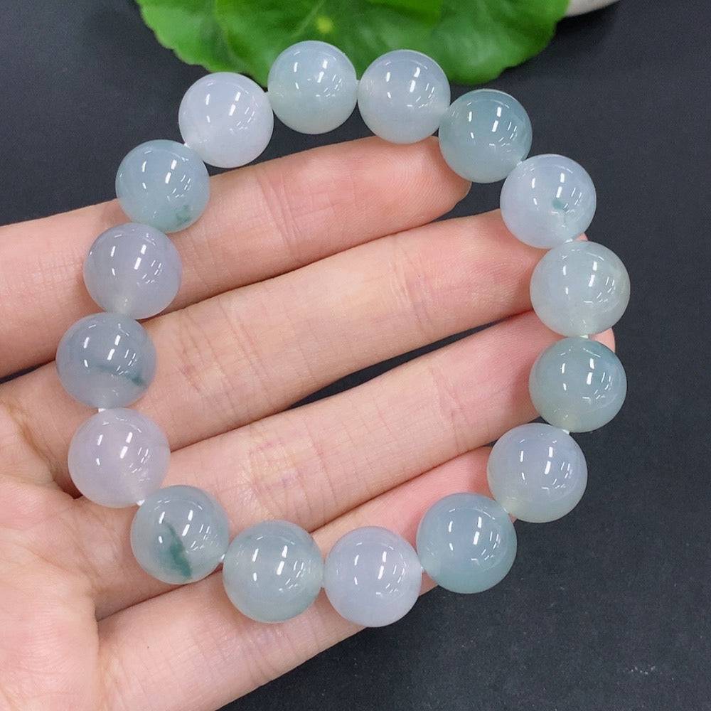 HUILIU HQ jadeite bracelet weighing 44.7g with 11.7mm beads, showcasing smooth, polished green jade stones.