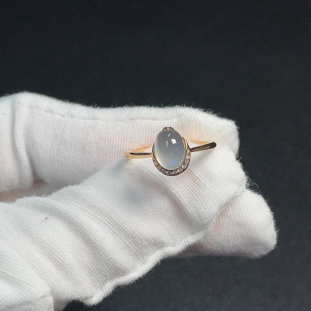 Huiliu certified moonstone ring featuring visible organic matter, showcasing natural gemstone details and craftsmanship.