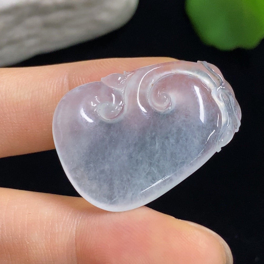 Jadeite Ruyi carving jewelry by HKHQ with intricate inlaid setting, showcasing detailed craftsmanship and glossy jadeite surface.