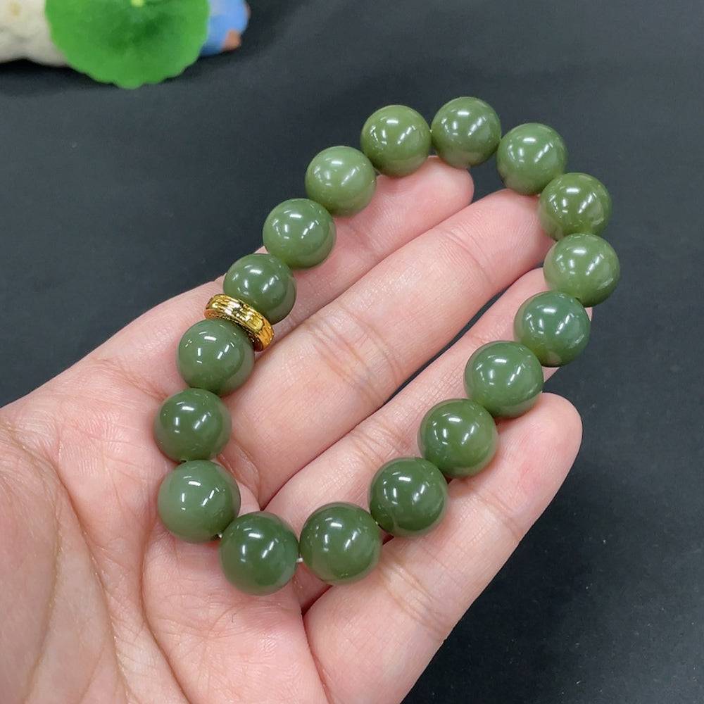 Huiliu certified Hetian jade bracelet with 12mm smooth beads, showcasing natural green jade and elegant craftsmanship.