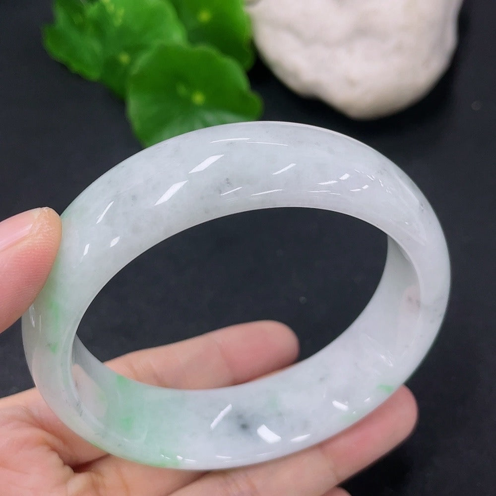 HKHQ jadeite round bangle in size 56, weighing 70.83g, featuring a smooth, polished green jadeite surface.
