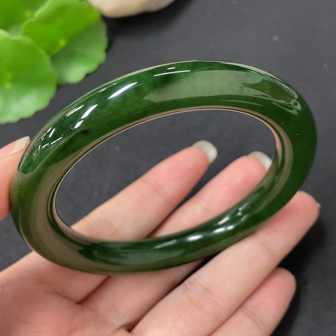 HKHQ Hetian jade green round bangle, 58.7mm size, weighs approx. 56.9g, showcasing smooth, polished jade surface.