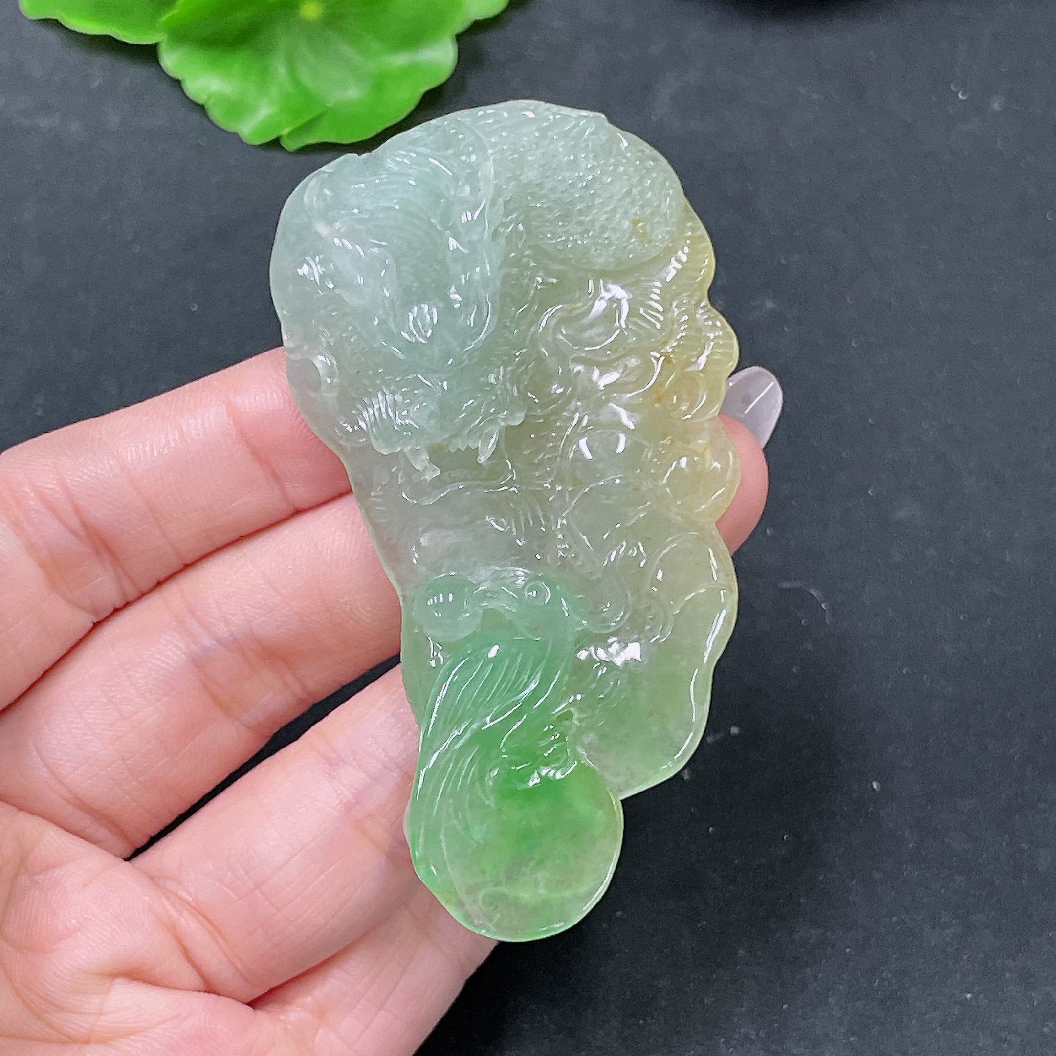 Jadeite pendant featuring a carved dragon plaque from HUILIU HQ, weighing approximately 36.62 grams, with detailed jade craftsmanship.
