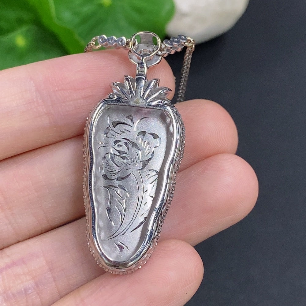 Jadeite leaf pendant with 18K gold accents and diamond details, weighing approximately 12g including chain, from HKHQ.