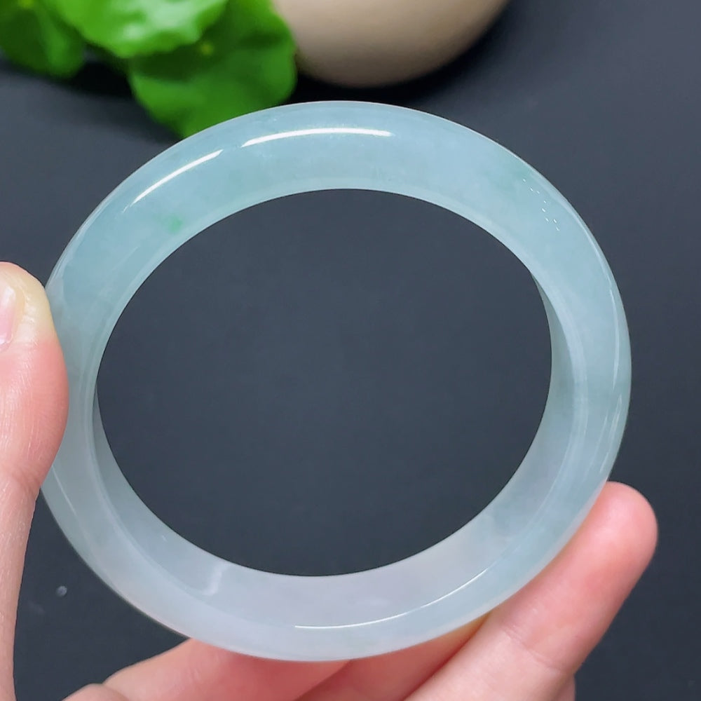 HKHQ jadeite round bangle in size 57.2 with a weight of 56.76g, showcasing smooth, polished green jadeite bracelet.