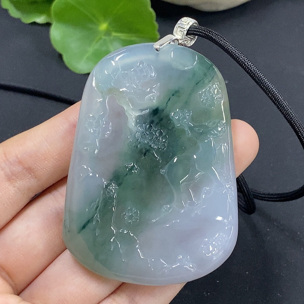 Jadeite landscape pendant by HKHQ featuring non-gold inlay, weighing approximately 44.67g with rope, showcasing detailed jade craftsmanship.