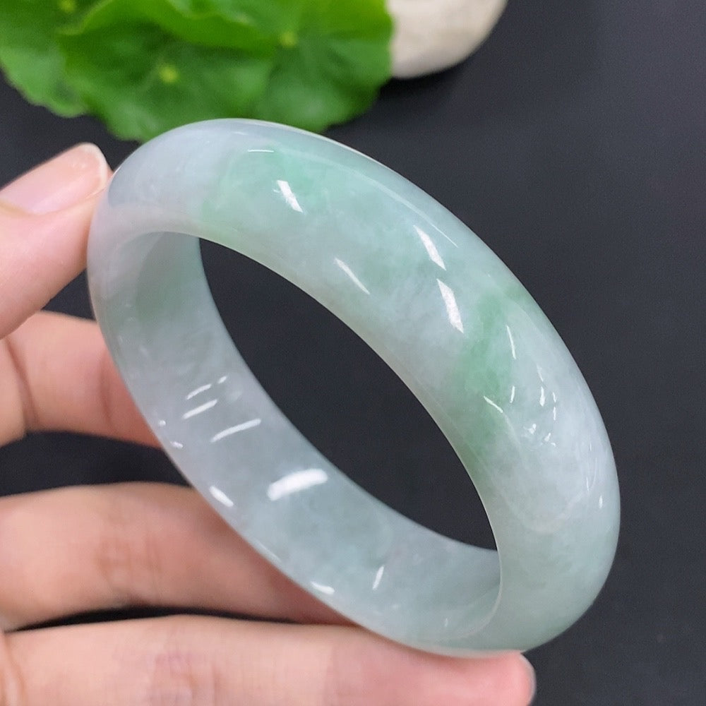 Jadeite round bangle by HKHQ, featuring smooth green jade with a total weight of 64.6g and size 54.5mm.