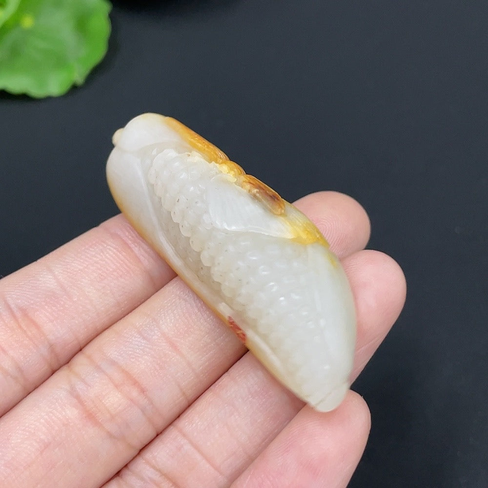 HKHQ Hetian jade pendant necklace featuring a corn-shaped formation with undetermined skin color appearance.