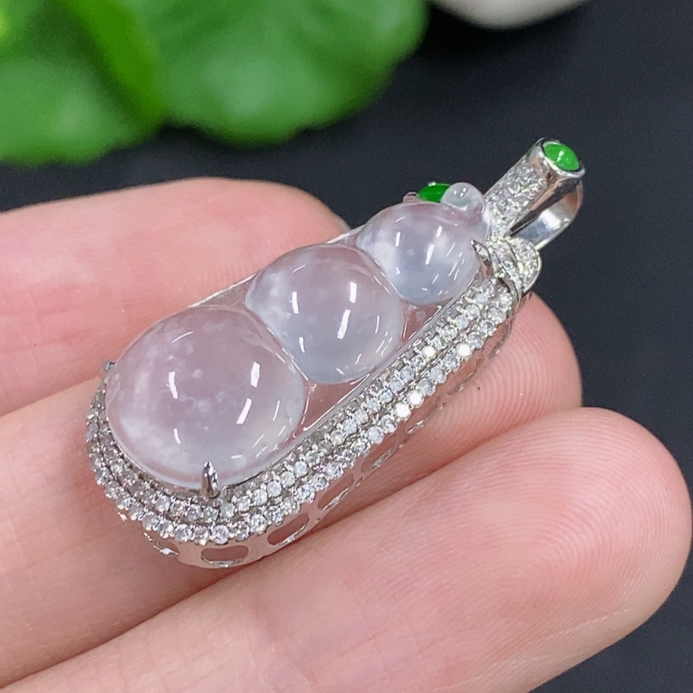 Jadeite Lucky Bean pendant with 18K gold and diamond accents, showcasing a smooth, polished jade design with intricate details.