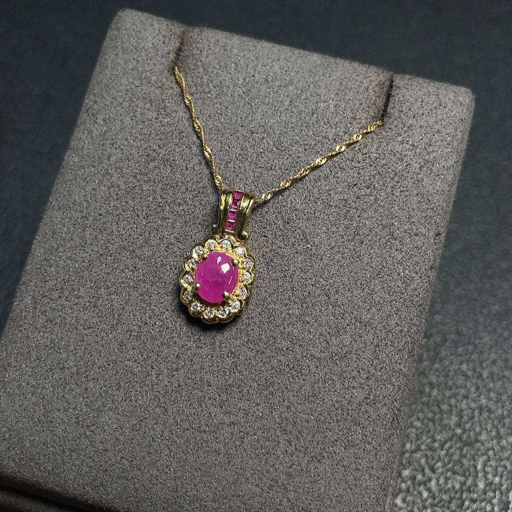 Huiliu Ruby Necklace with diamond accents showcasing vibrant red gemstones and sparkling diamond details.