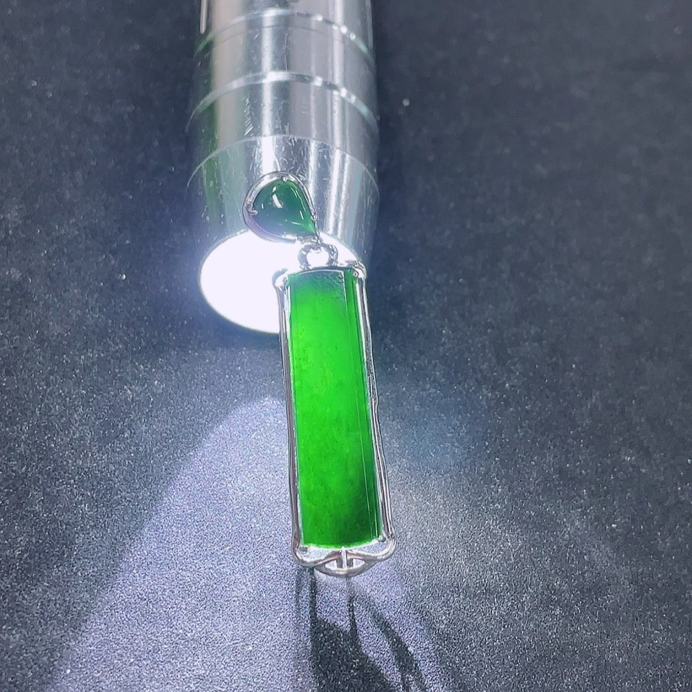 Jadeite plain pendant with 9k gold mounting, showcasing a smooth jade stone on a delicate gold setting, weighing approximately 3.92g.