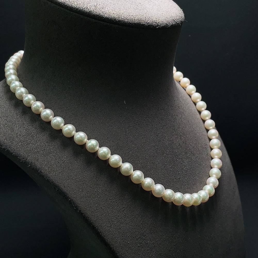 Huiliu seawater pearl necklace with 7.5mm round pearls, certified quality, showcasing elegant pearl strand on a neutral background.