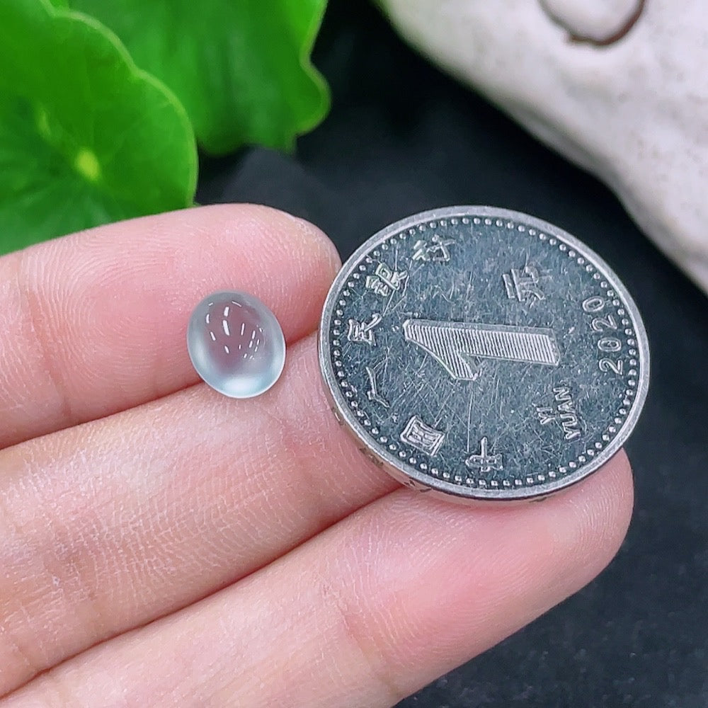 Jadeite cabochon jewelry by HKHQ, 0.27g, showcasing a smooth, polished green gemstone with natural variations