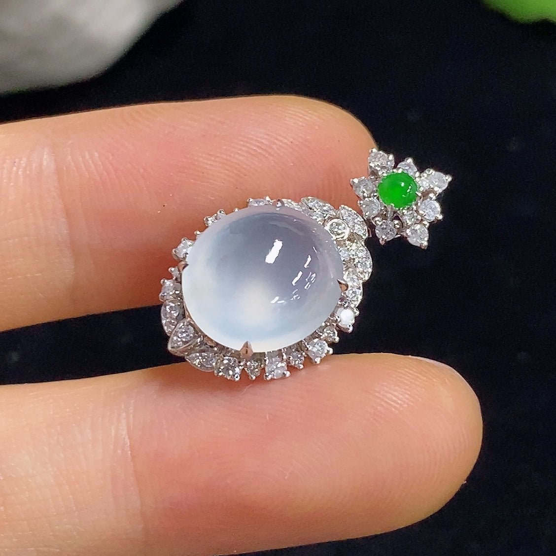 Jadeite pendant with 18K gold and diamond accents, showcasing a polished green jade stone on a delicate necklace.