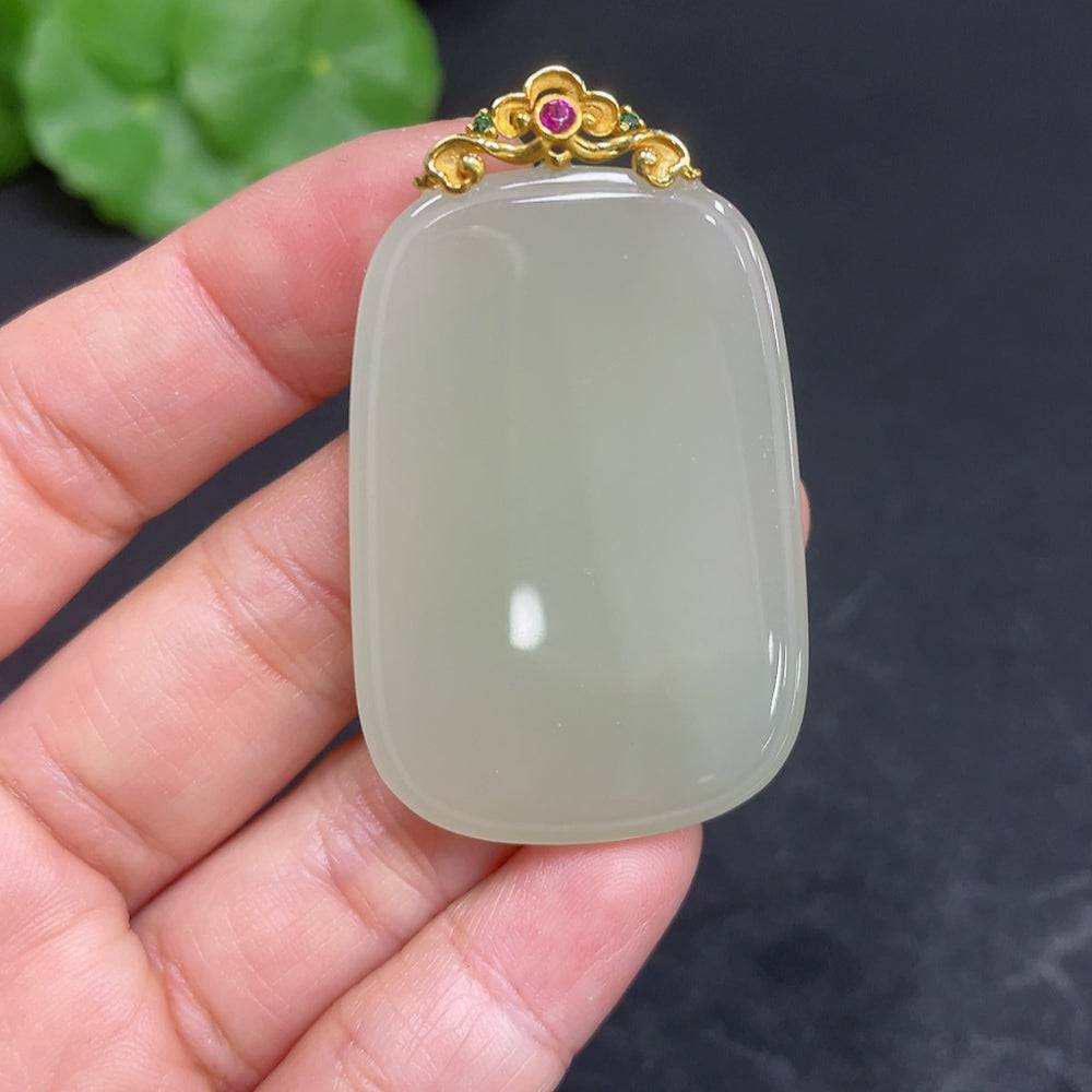 Huiliu Certified Hetian jade pendant with plain design and clasp, showcasing smooth, polished jade stone in natural light.