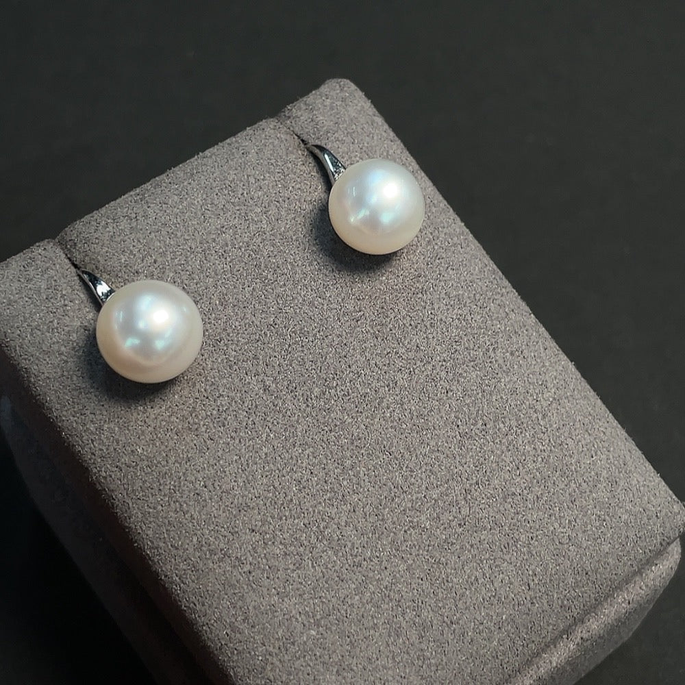 Seawater pearl earrings with 18K gold setting, 11.2mm pearls, HKHQ brand, featuring elegant, round pearl jewelry.