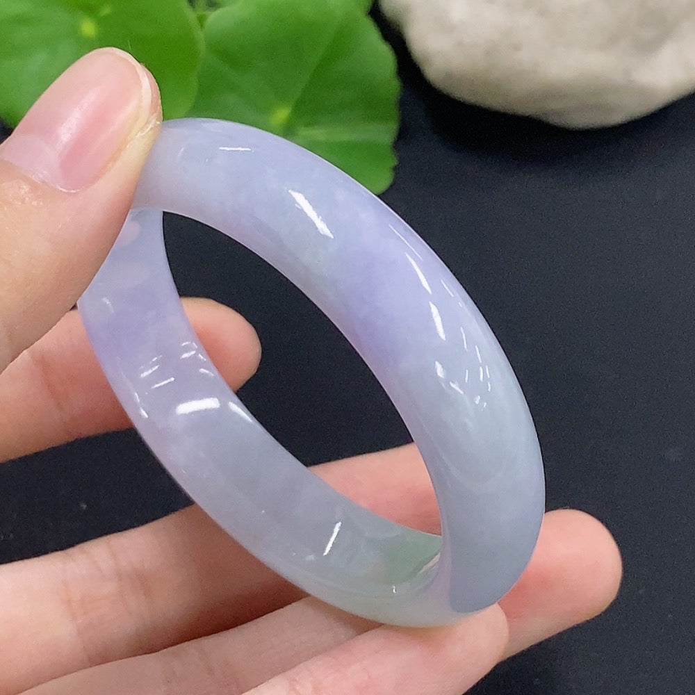 Jadeite oval bangle bracelet from HKHQ in size 50.2 with a 33.7g weight, showcasing smooth, polished green jadeite jewelry.