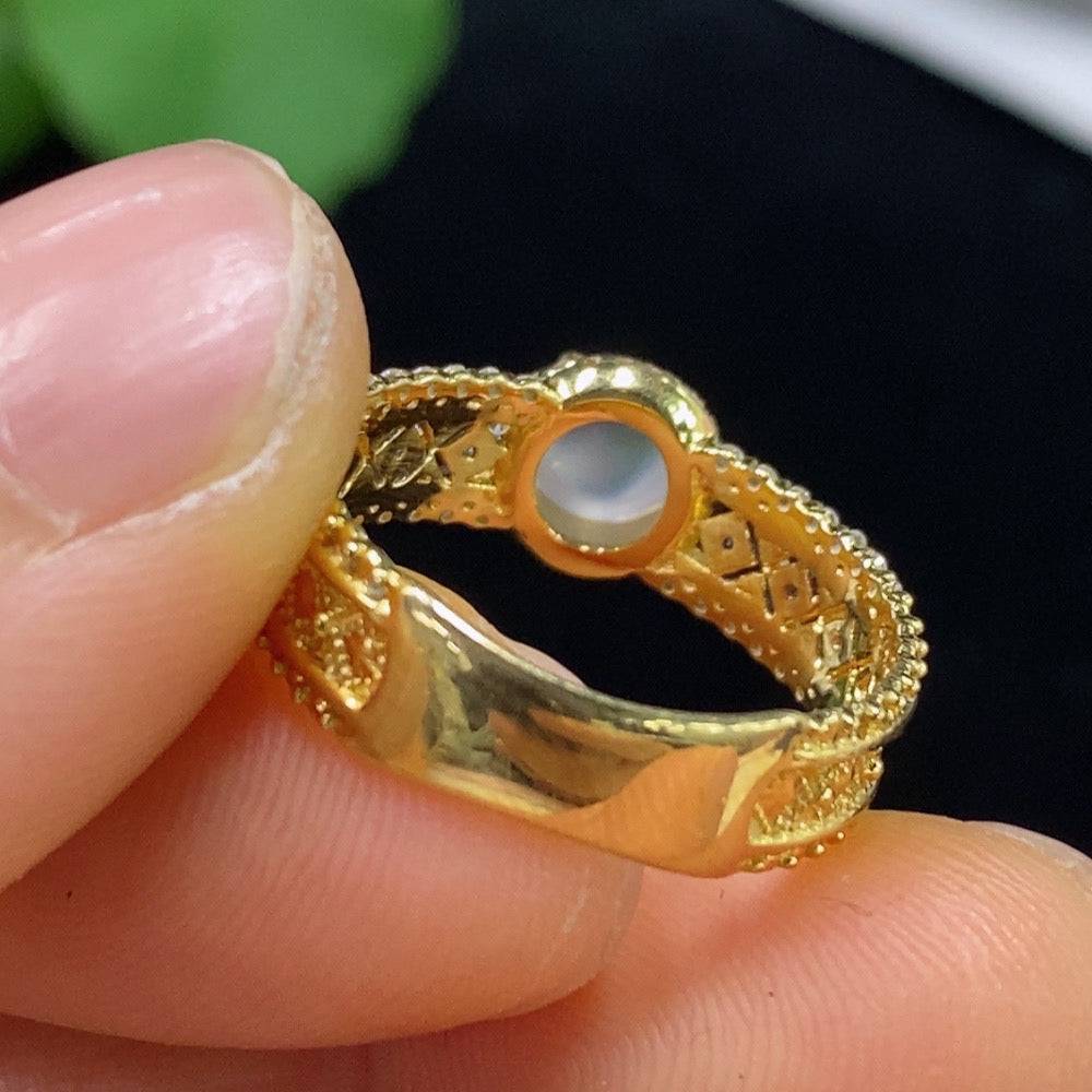 Huiliu jadeite cabochon ring with diamond accents, showcasing polished green jade and sparkling gemstones on a silver band.