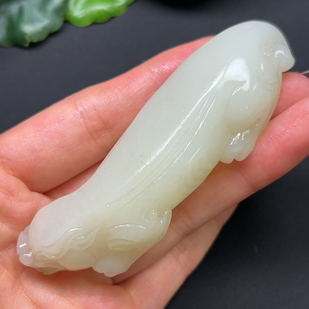 Heitian jade Pixiu pendant from HKHQ, intricately carved, weighing approximately 80g, showcasing detailed jade craftsmanship.