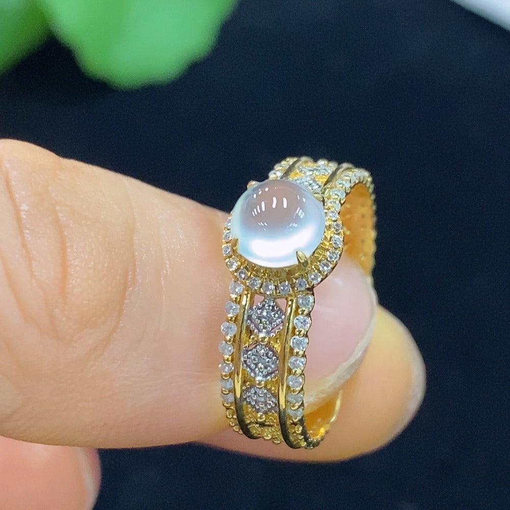 Huiliu Jadeite cabochon ring with diamond accents, featuring a polished green jade gemstone and elegant design.