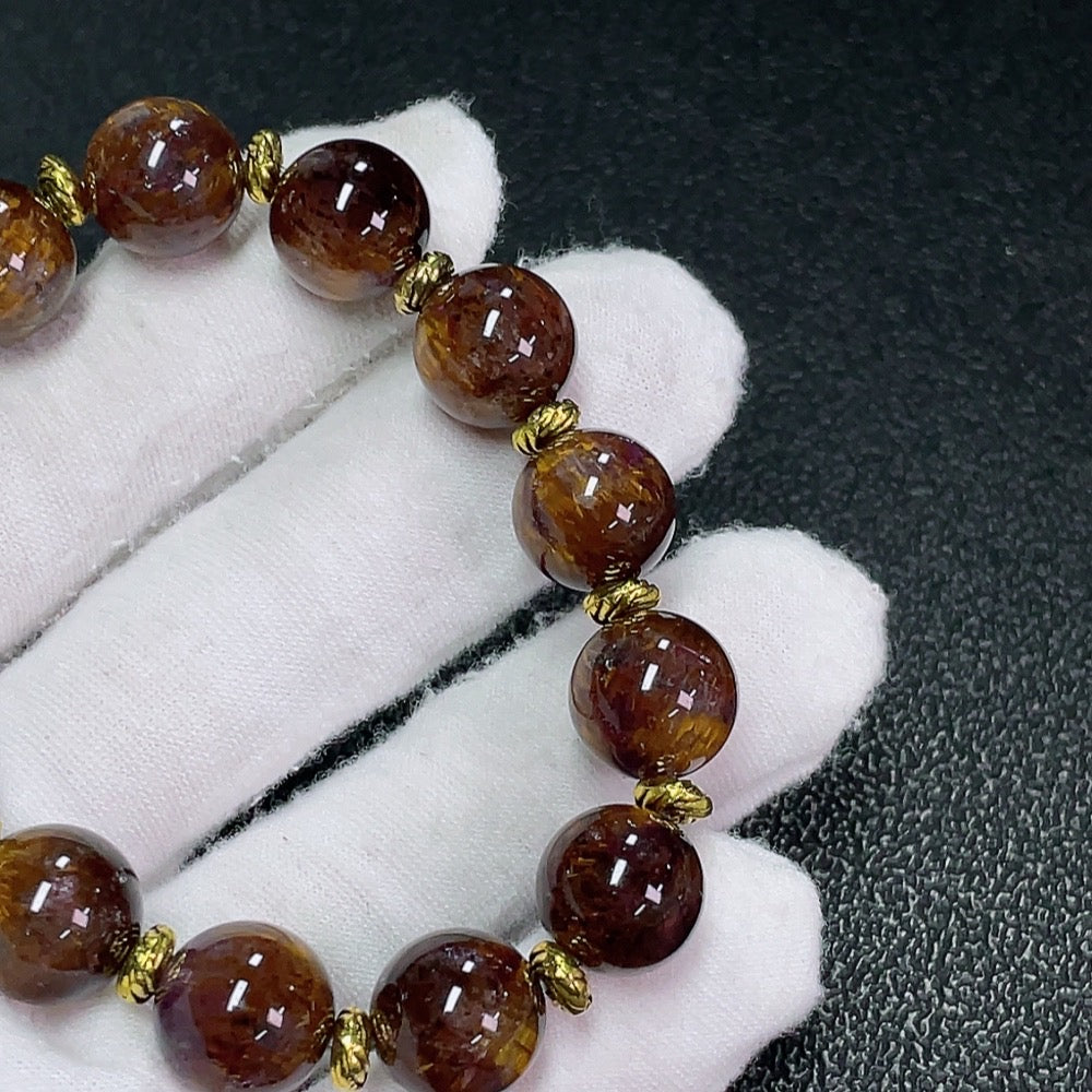 HKHQ gemstone crystal bracelet with non-gold setting, 12mm stones, approximately 36 grams, featuring sparkling crystal gemstones.