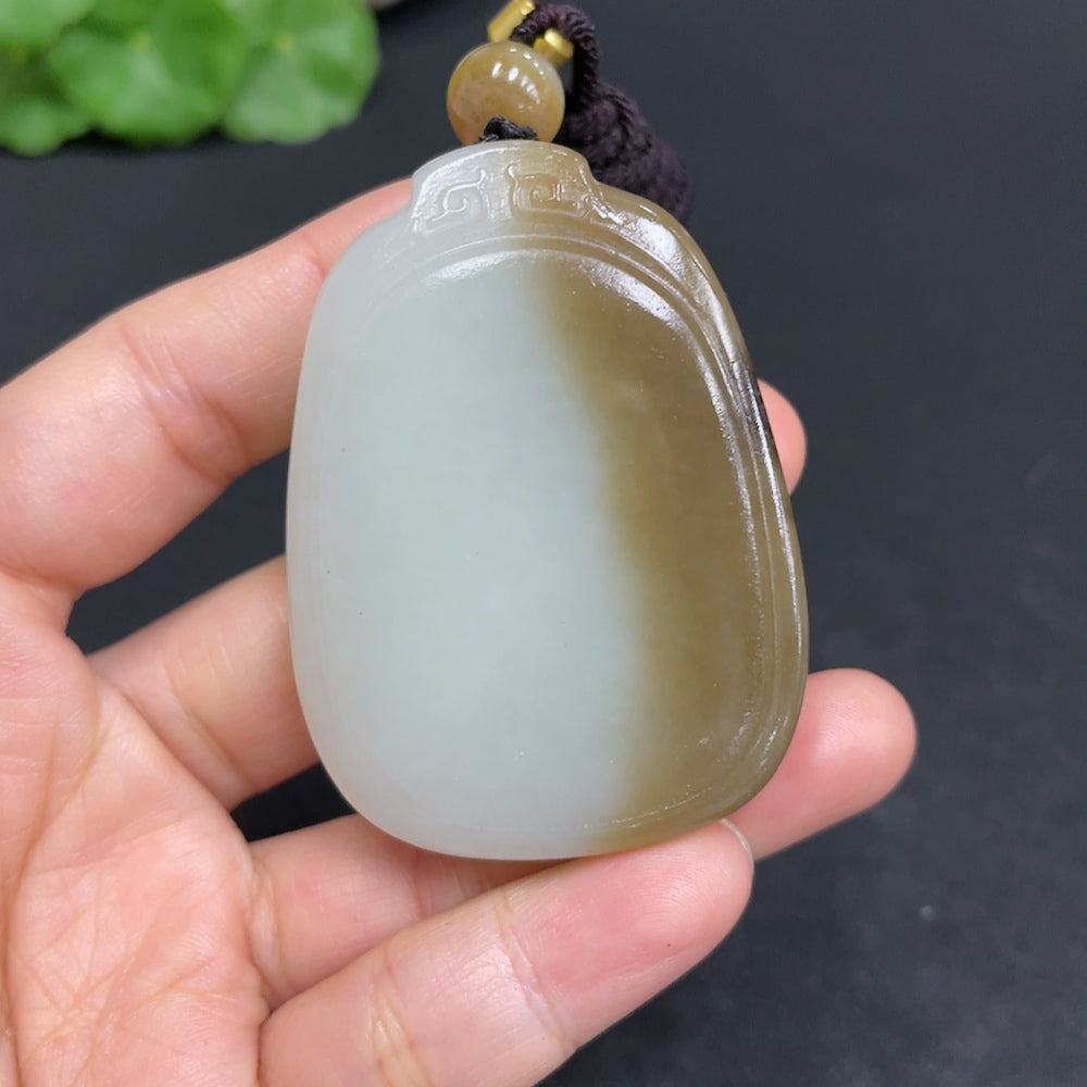 Huiliu certified Hetian jade pendant featuring a plain, smooth jade stone with natural greenish hue and polished finish.
