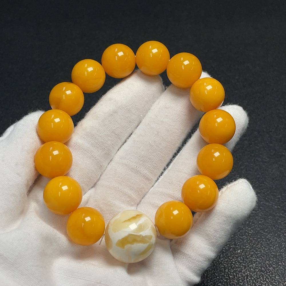 Huiliu Amber Beeswax bracelet featuring 18.4mm amber beads, natural and handcrafted jewelry with a warm, golden hue.