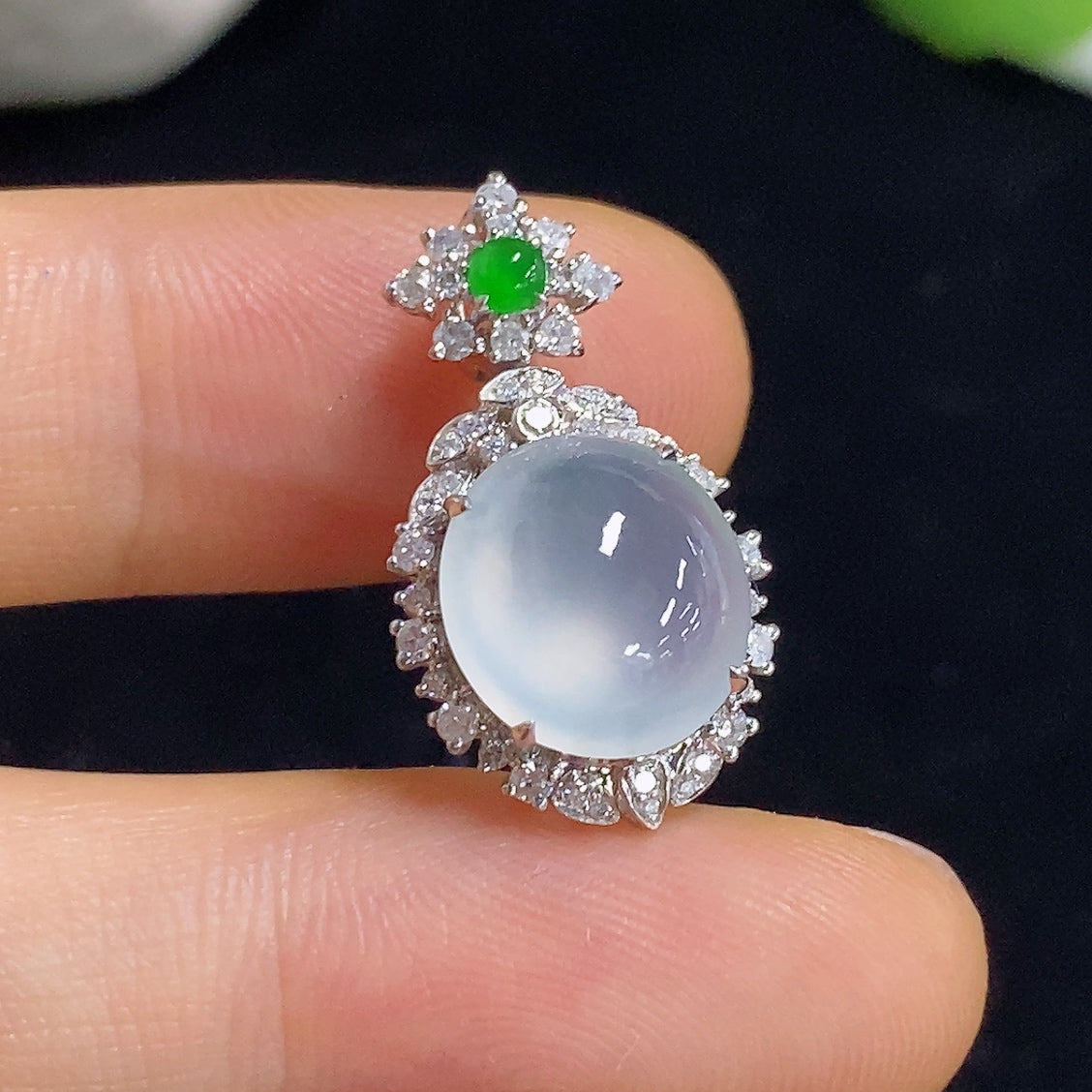 Jadeite pendant with 18K gold setting and diamond accents, elegant necklace jewelry featuring a polished jadeite stone.