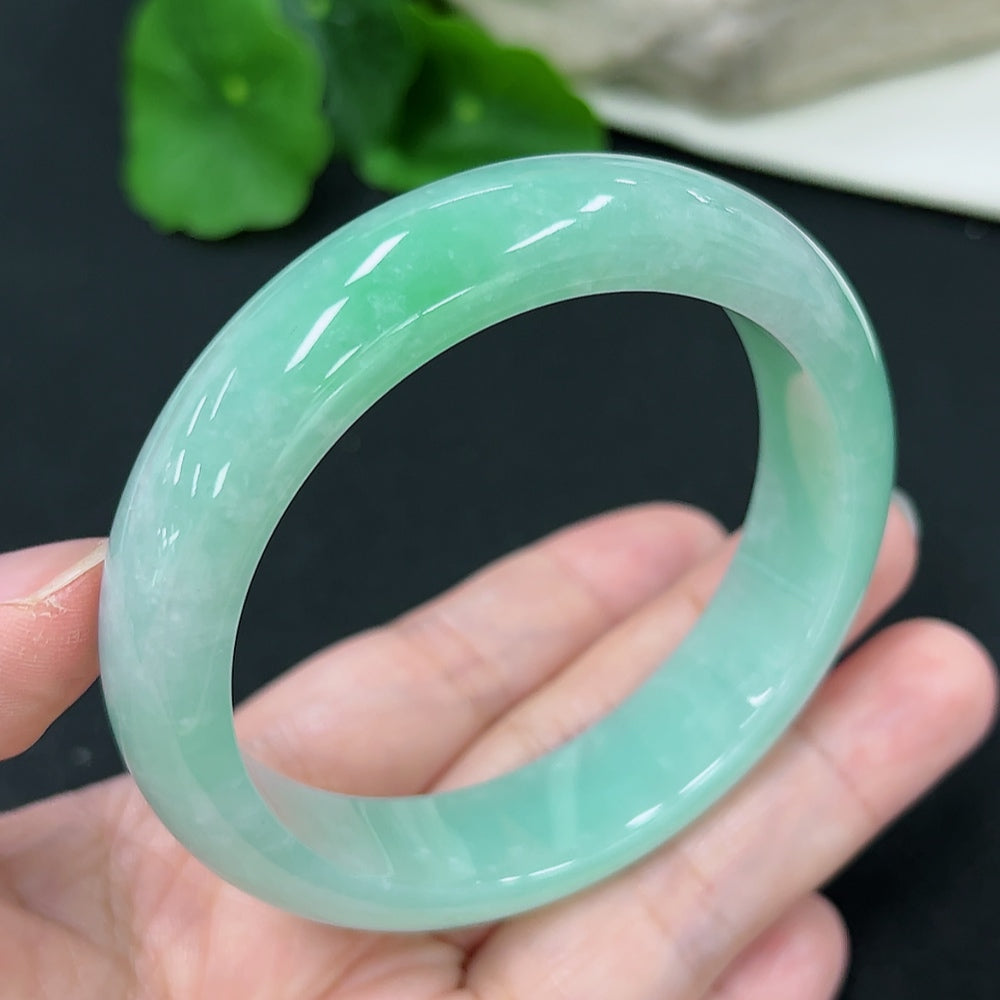 HKHQ Jadeite round bangle size 57.7 with approx. 66g weight, featuring smooth, polished jadeite surface and classic bracelet design.
