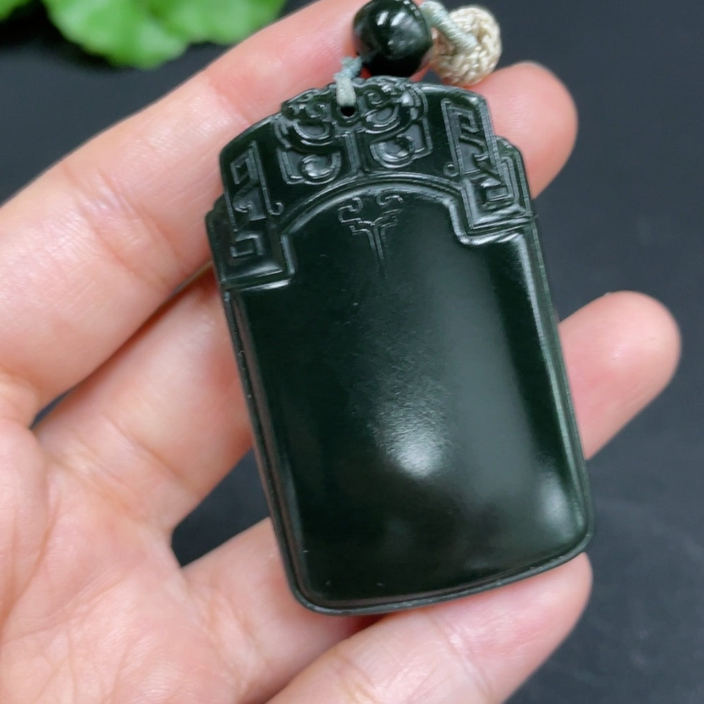 Huiliu certified Hetian jade pendant with antique plaque design and rope, showcasing intricate carvings and smooth jade surface.