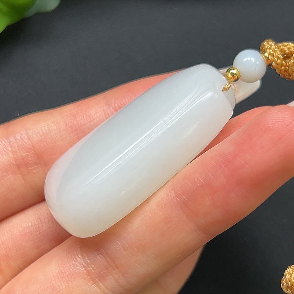 HKHQ Hetian Jade plain pendant with rope, weighing approximately 27.31g, showcasing smooth, polished jade in a simple, elegant design.