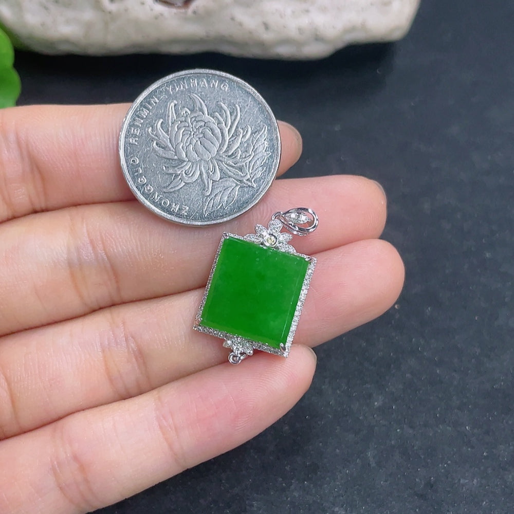 Jadeite pendant with 18k gold and diamond accents, showcasing a polished green jade stone on a delicate necklace.