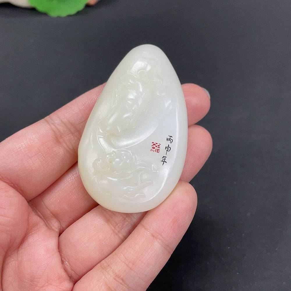 Huiliu certified Hetian jade pendant featuring Guanyin figure with undetermined skin color, crafted from smooth, polished jade.