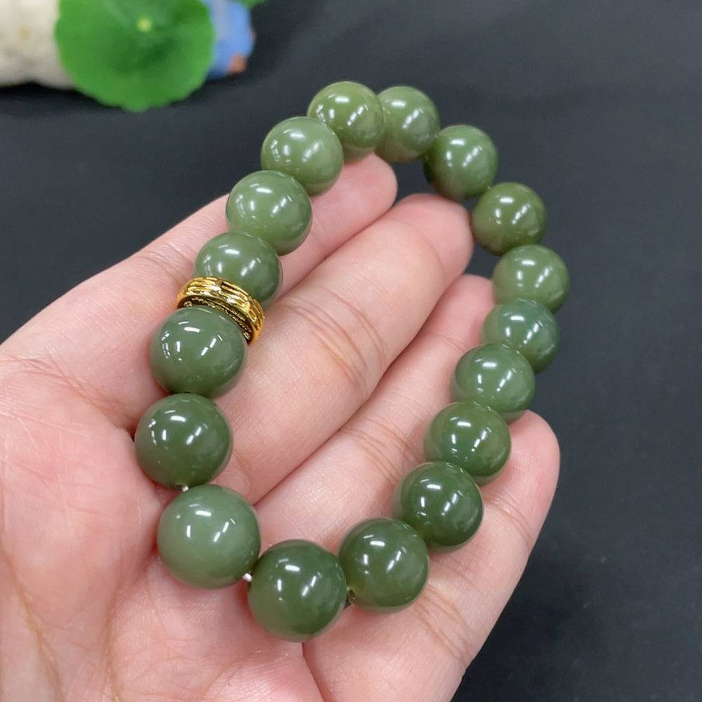 Huiliu certified Hetian jade bracelet with 12mm smooth jade beads, showcasing natural green and white gemstone details.