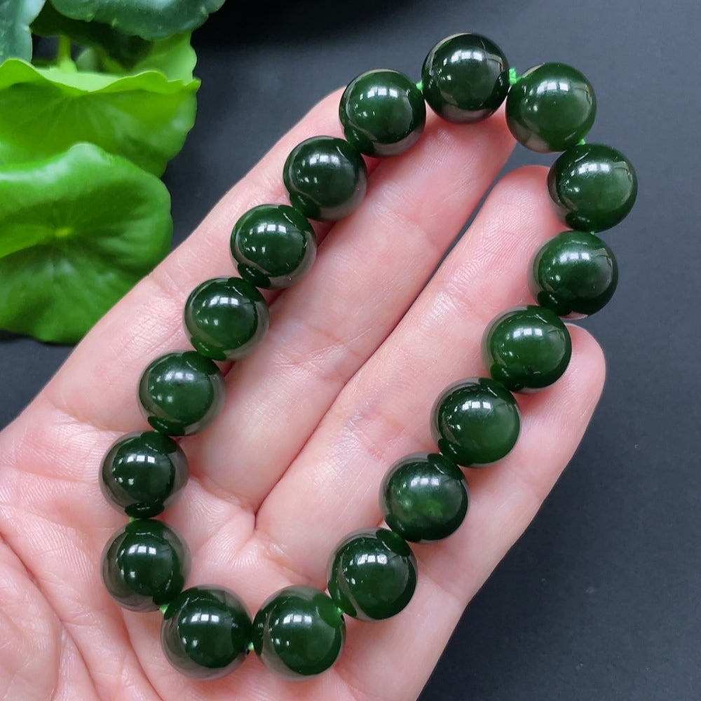 HKHQ Hetian Jade bracelet with 11.9mm beads, showcasing smooth, polished green jade stones and a total weight of 45.24g.