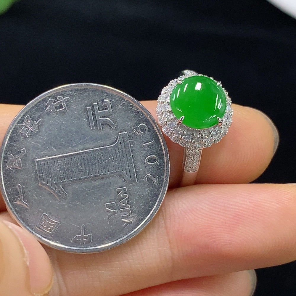 Jadeite ring by HUILIU HQ featuring 18k gold band and diamond accents, size 14, weighing approximately 2.57 grams.