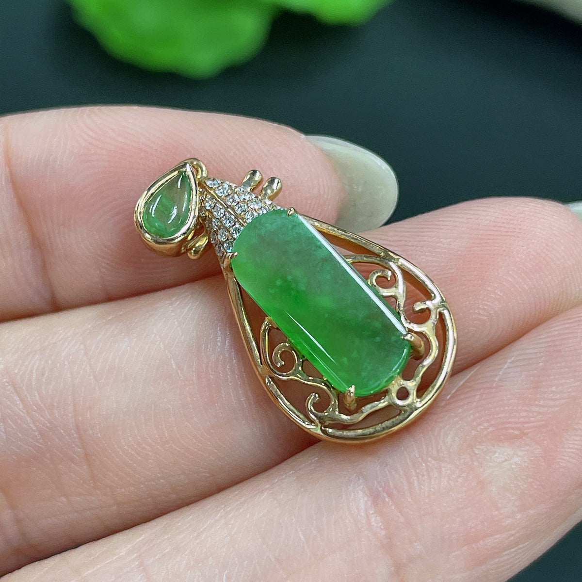 Jadeite pendant with 18k gold inlay and diamond accents, weight approx. 3.5g, featuring a polished jade gemstone and intricate design