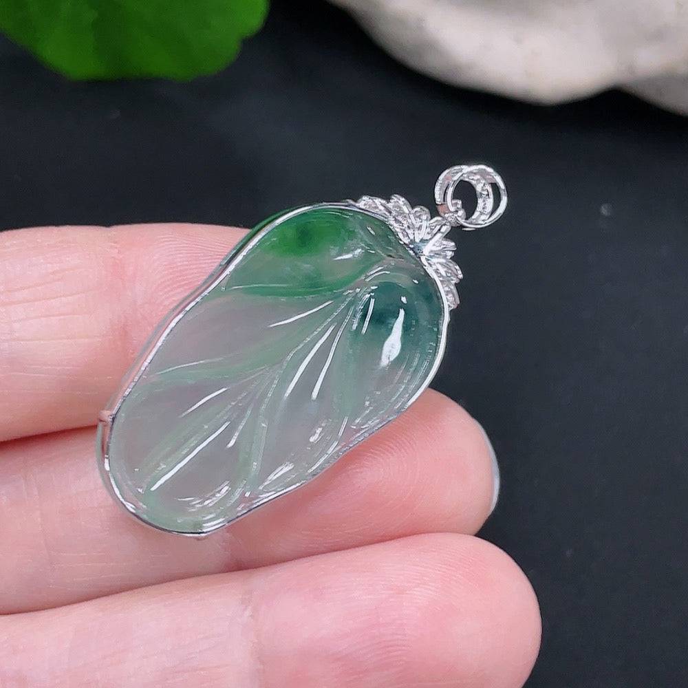 Jadeite pendant leaf with 18k gold and diamond accents, showcasing intricate design and polished jade surface.
