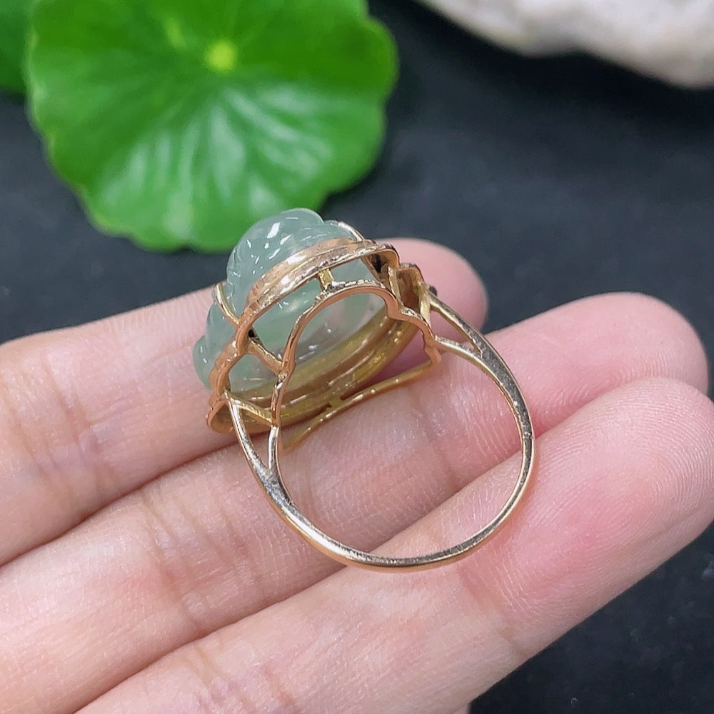Elegant jadeite inlaid ring with 18K gold and diamond accents, showcasing intricate craftsmanship and luxurious design.