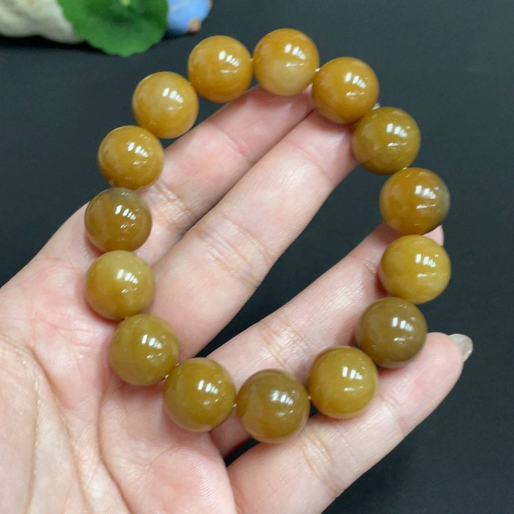 Huiliu certified Hetian jade bracelet with 13.9mm smooth, rounded jade beads showcasing natural green and white hues.