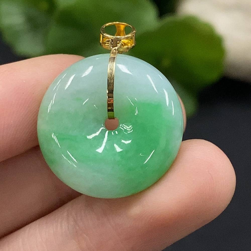 Jadeite safety buckle pendant by HUILIU HQ with 18K gold accents and diamond details, featuring a smooth jade surface.