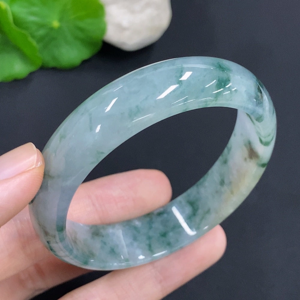 HKHQ jadeite oval bangle in size 58.8 with a smooth polished surface, weighing 47.7g, showcasing elegant craftsmanship.