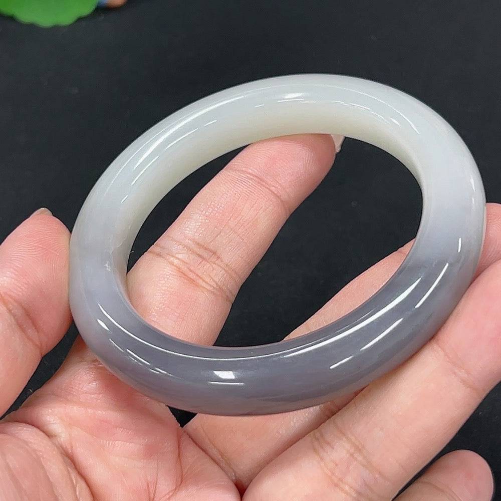Huiliu certified Hetian jade round bracelet featuring smooth, polished jade beads in natural green and beige tones.