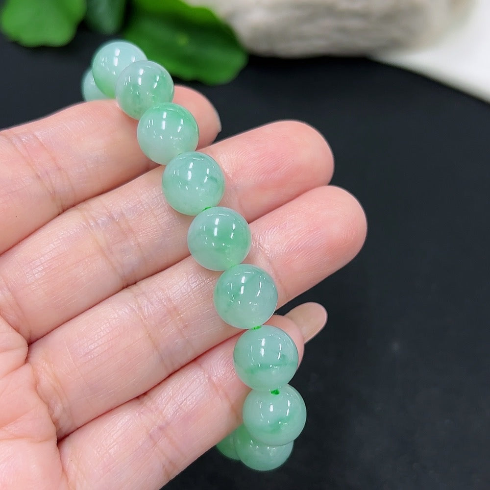 Elegant jadeite bracelet from HKHQ featuring smooth, polished jade beads on a delicate string for a stylish jewelry accessory.
