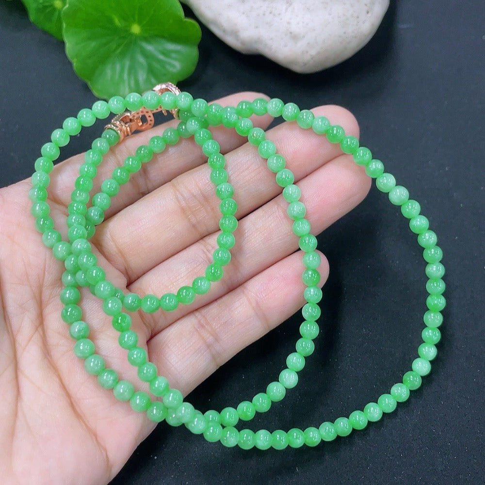Jadeite bead necklace by HKHQ featuring smooth, round jade beads, weighing 17.87g, on a simple string.