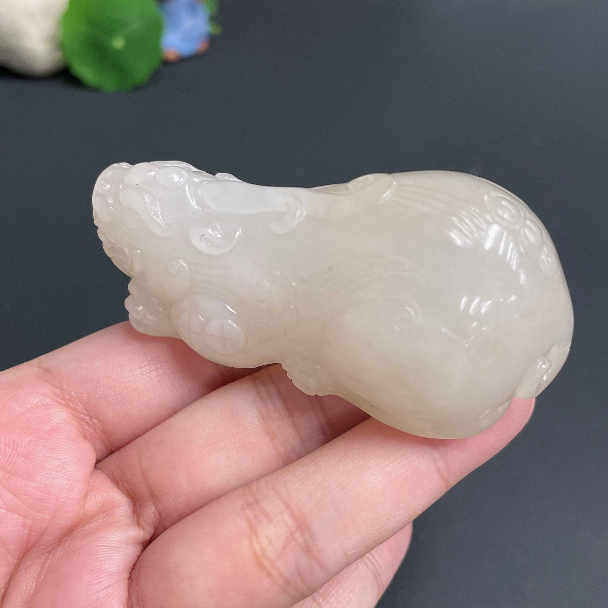 Huiliu certified Hetian Jade handheld Pi Xiu figurine, intricately carved jade piece with detailed features, from HUILIU HQ.
