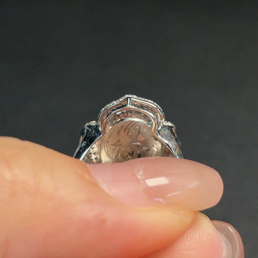 Huiliu Sapphire Ring with diamond accents, featuring a vibrant blue gemstone and sparkling diamond details on a silver band.
