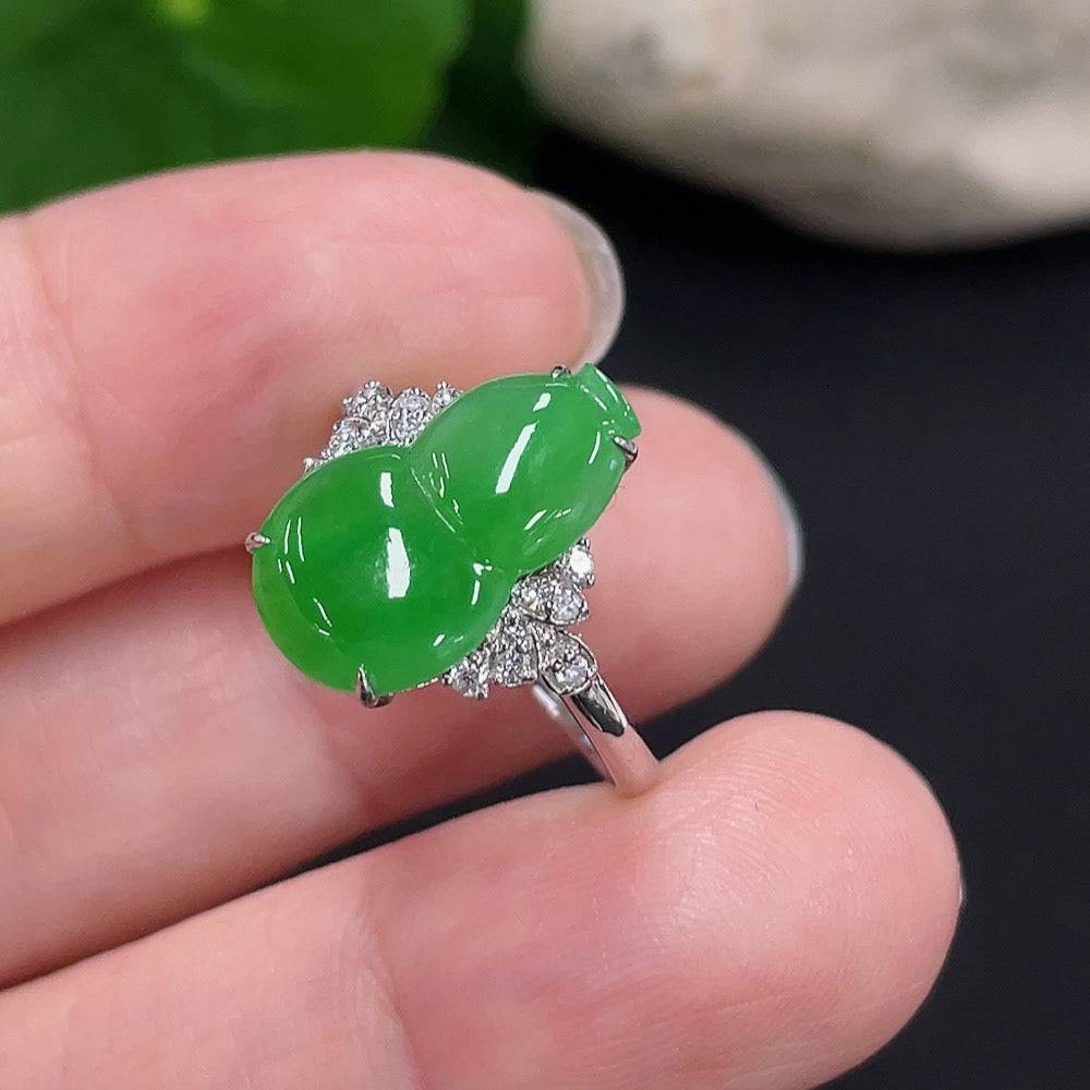 Jadeite gourd pendant with 18K gold inlay and diamond accents, displayed against a neutral background.