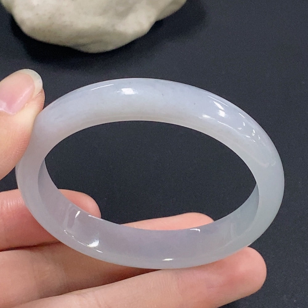 Jadeite oval bangle bracelet in size 51.6 with a weight of 31.71g, featuring smooth, polished jadeite from HKHQ.