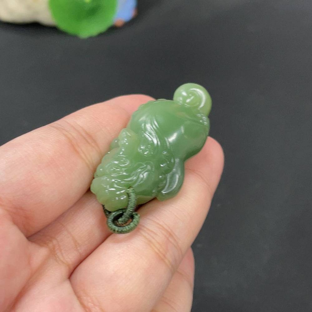 Huiliu HQ Hetian jade pendant featuring an auspicious beast, intricately carved in smooth, polished jade stone.